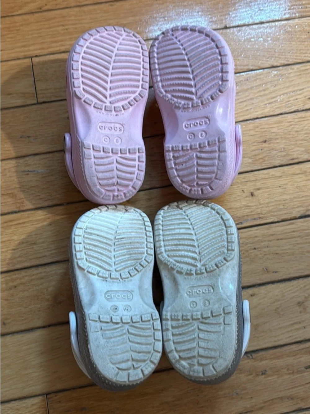 2 pairs of kids crocs- pink and sparkly silver 8C